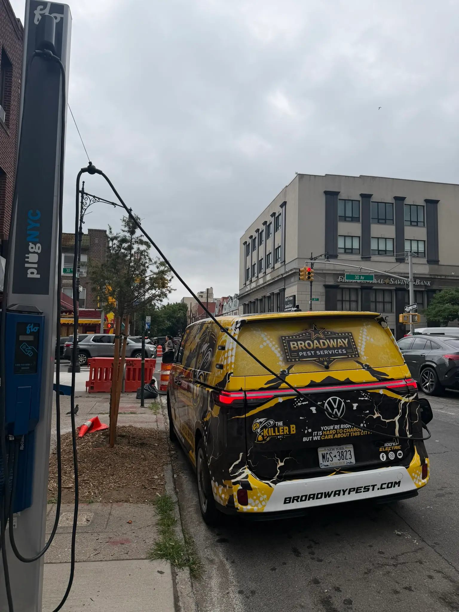 Broadway Pest Services VW ID Buzz all-electric van charging at PlugNYC Flo charging station in NYC